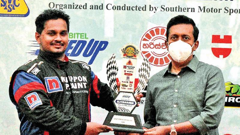 Fastest driver Ushan Perera receiving the coveted Trophy from Chief Marketing Officer SLT-Mobitel Prabath Dahanayake