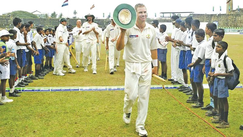Shane Warne leaves the field after bowling Australia to win the first Test in Galle in March 2004 nine months before the tsunami left the ground in ruins