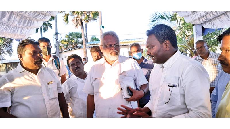 A fisher representative makes a point to Fisheries Minister Douglas Devananda