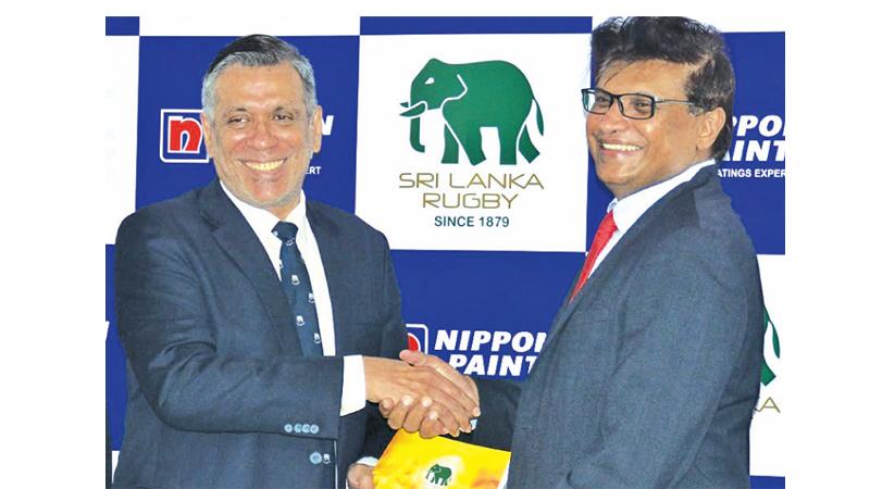 Signed, sealed and delivered. Sri Lanka Rugby president Rizly Illyas (left) and Nippon Paint general manager Nemantha Abeysinghe come together after a closely guarded alliance (Pic by Ranjith Asanka)