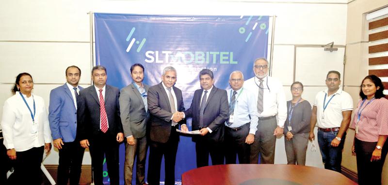 After signing the agreement: SLT-Mobitel and Softlogic IT officials  