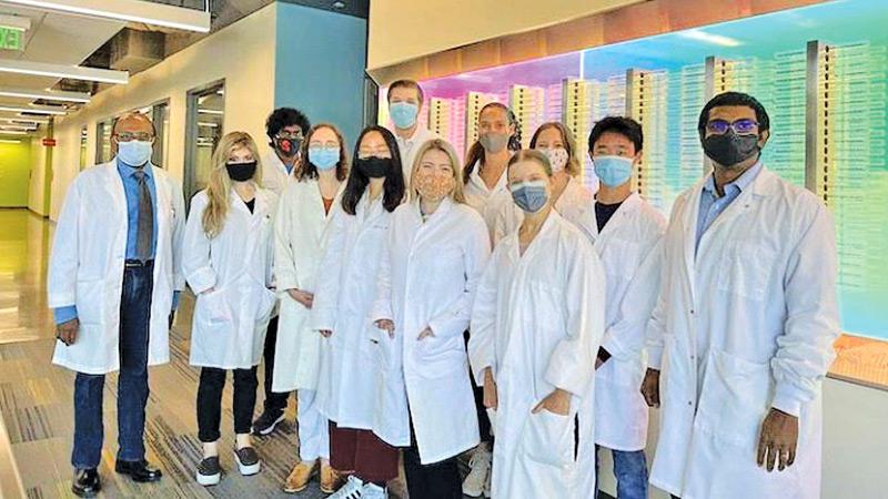 Dr. Richard Gunesekara (left) with his research team