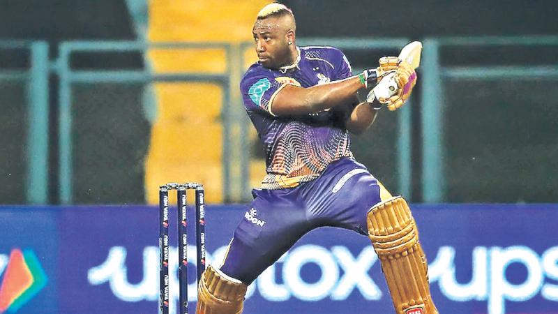 Andre Russell cuts a ball to the boundary