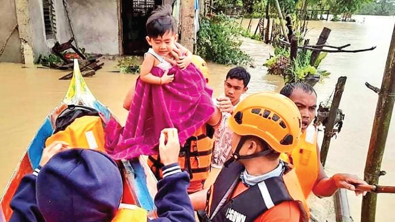 Rescue efforts continue in the central Philippines after devastating floods and landslides