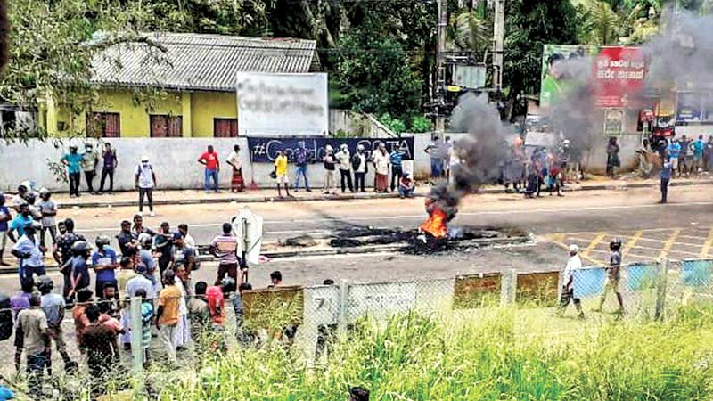 Protesters blocked a road and set alight tyres in Rambukkana (BBC)