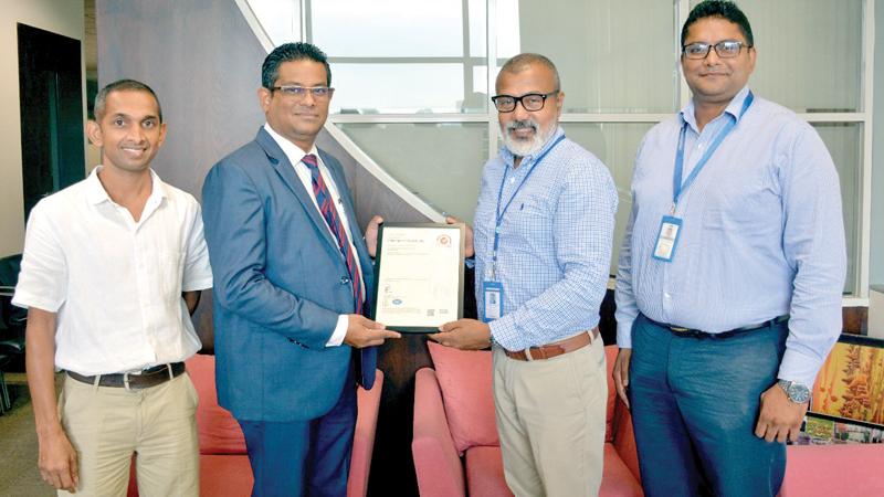  Business Manager, Knowledge, SGS Lanka Chamika Wimalasiri presents the ISO 45001: 2018 certification to Vice President, Aitken Spence Travels, Suranga Ratnayake. Head of Sustainability, Aitken Spence Travels, Indika Abeykoon (on right) and Assistant Manager, Sustainability, Aitken Spence Travels, Upul Kumara look on. 