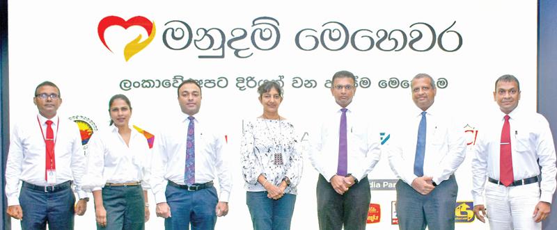 From left: Senior Promotions and Activations Manager, CBL Food Cluster, Sisira Gunawardane, Senior Manager Corporate Communication and Sustainability, CBL Group, Ishara Wickramasinghe, General Manager, Marketing, CBL Food Cluster, Jayanga Perera, Group Managing Director, CBL Group, Sheamalee Wickramasingha, Group Chief Executive, Dialog Axiata, Supun Weerasinghe, Group Chief Officer, Dialog Enterprise, Navin Pieris, and Executive Director, Sarvodaya Shramadana Movement, Chaminda Rajakaruna.
