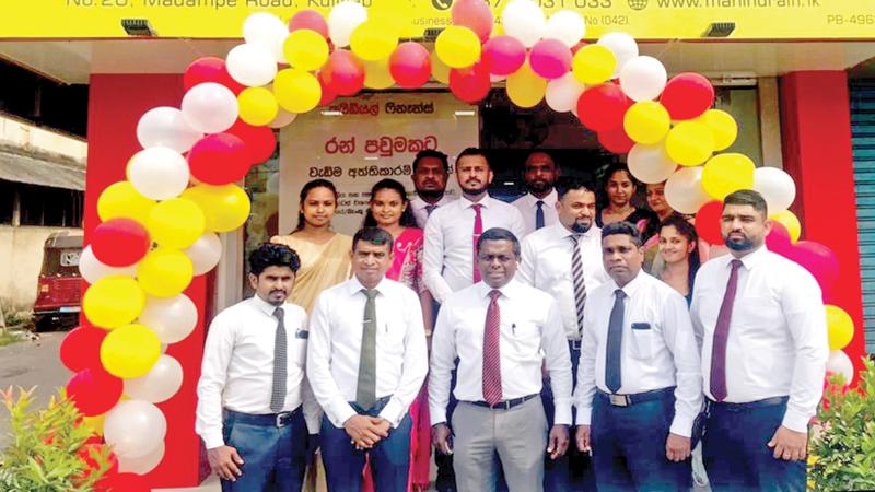 Branch staff of the newly opened Kuliyapitiya branch with the senior management of Mahindra Ideal Finance.