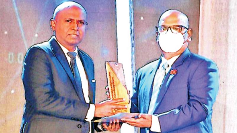 Managing Director of Nevil Industries, Nevil Anthony receives the award