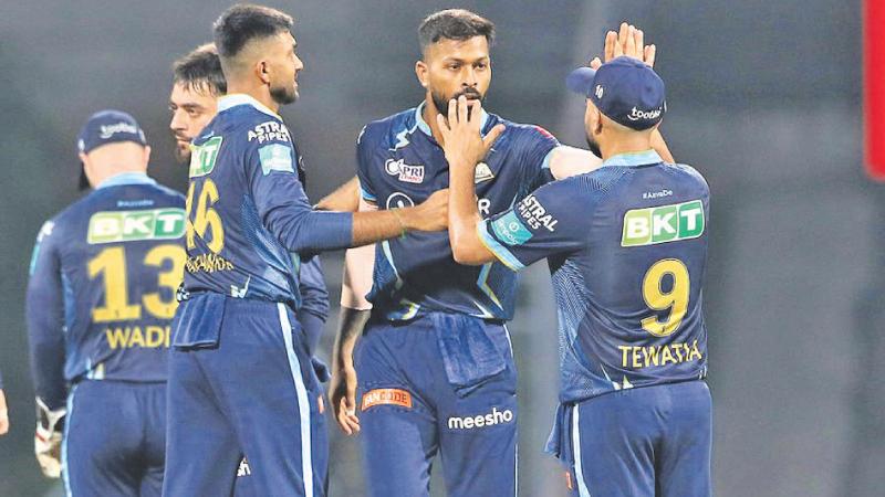 The Gujarat Titans team players celebrate victory