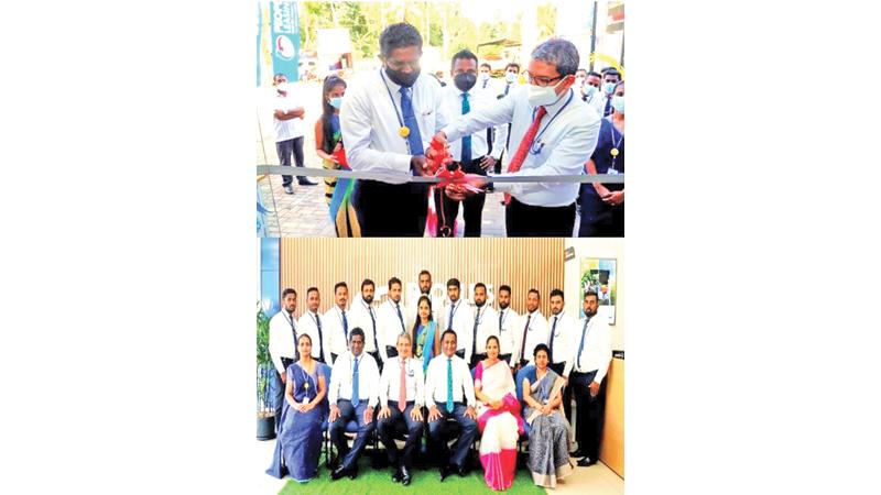People’s Leasing and Finance  General Manager Shamindra Marceline (right) and Giriulla Branch Manager Thissa Danendra open the branch. People’s Leasing and Finance   Deputy General Manager – Operations, Laksanda Gunawardene looks on. Below: Giriulla branch staff with the senior management