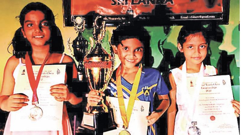 Under-8 winners from left: Syathara Dissanayake (silver), Hasadi Sethumsa (gold), Risali Jayaweera (bronze
