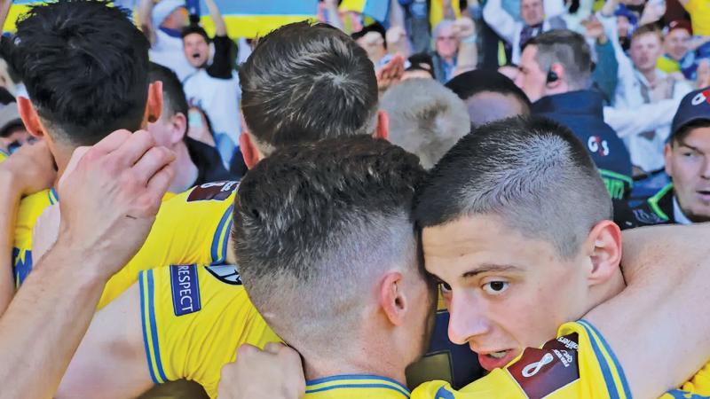 Ukraine players huddle in emotional scenes after beating Scotland 3-1 in a World Cup qualifier at Hampden