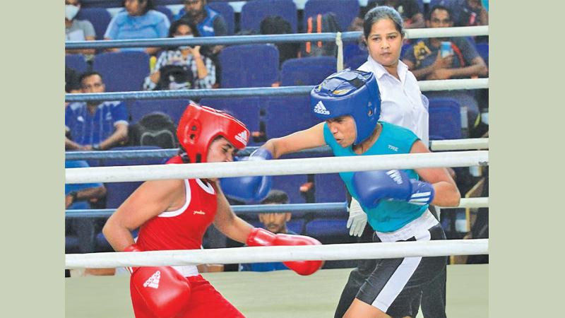 WWNL Kumari of Upcountry Lions punches Police’s PM Vidanagamage in the Light Fly weight final