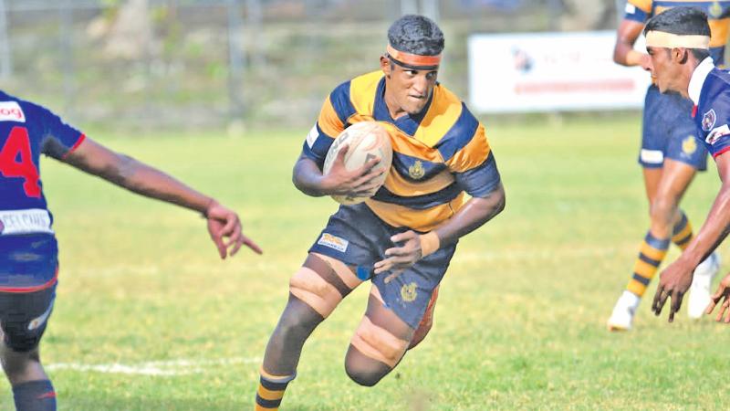 Royal College prop forward Shenal Adikaram makes a powerful run to score(Pic Thepapare team)