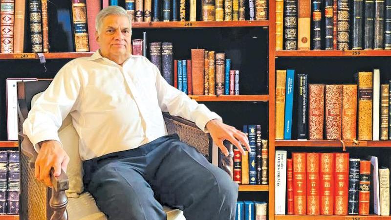 Prime Minister and Acting President Ranil Wickremesinghe in his library