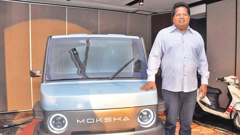 Ideal Group Chairman Nalin Welgama with the Moksha EV car that was launched on Thursday