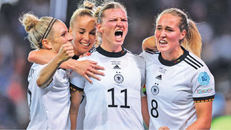 Germany’s players celebrate entering the Euro final after beating France
