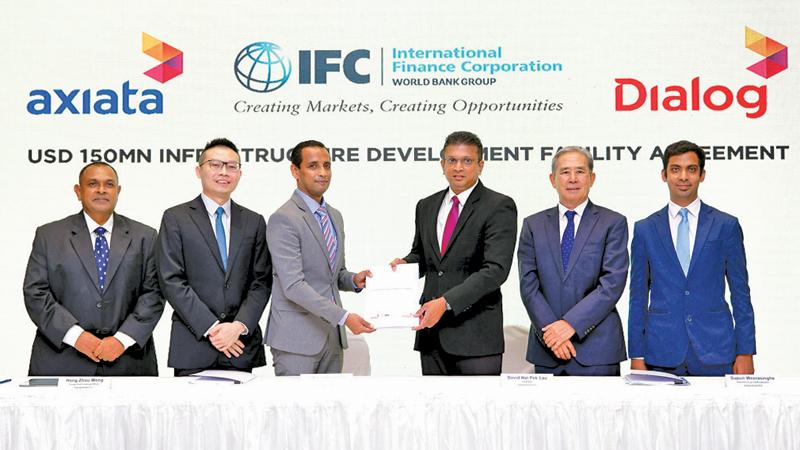 From left: Group General Counsel/Vice President, Group Legal and Regulatory, Dialog Axiata, Trinesh Fernando, Group Chief Financial Officer, Dialog Axiata, Wong Hong Zhou, Country Officer, IFC Sri Lanka and the Maldives, Victor Antonypillai, Director/Group Chief Executive, Dialog Axiata, Supun Weerasinghe, Chairman, Dialog Axiata, David Nai Pek Lau and Head, Corporate Finance, Dialog Axiata, Ahmed Riza.