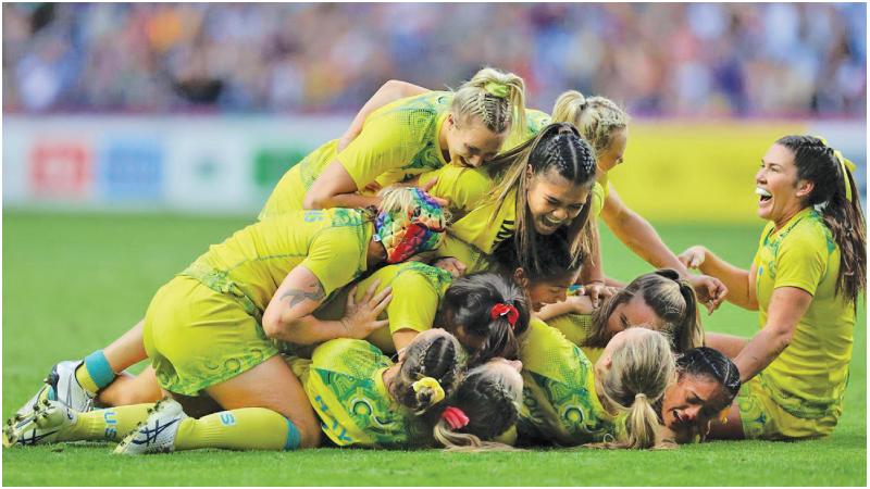 The Australian women’s rugby Sevens team react after winning the gold