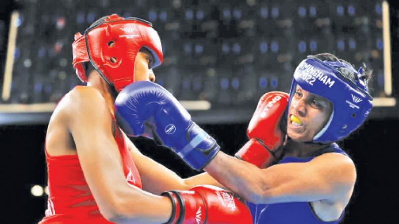 Sajeewani Cooray (Blue) exchanging blows with her South African opponent