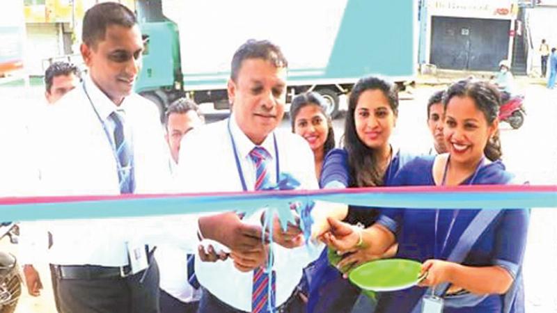 Chief Manager , Branch Operations of People’s Leasing and Finance,  Chamil Herath (center)  with  Manager, Kiribathgoda branch V. Niroshan (left), Deputy Manager,  Kiribathgoda Branch, Sanduni Keenawinna, Head of Documentation, Kiribathgoda branch, Ms. Sajeevi Keshala open the branch. 