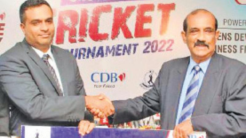 President of Mercantile Cricket Association Nalin Wickramasinghe receiving the sponsorship cheque for the sixth annual MCA Open Sixes from Senior General Manager Marketing of CDB Dharshana Jayasinghe. Picture by Wimal Karunatillike