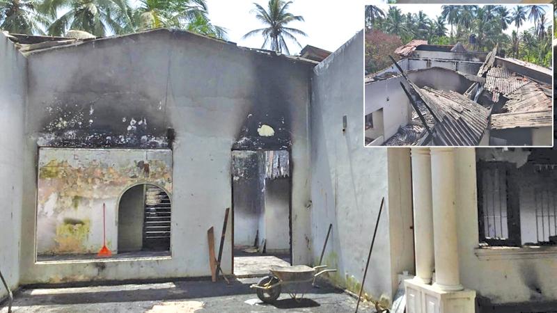 The house and office that were set on fire and destroyed by the rioters