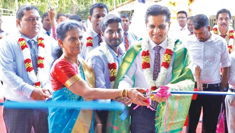 Group Director and Chief Operating Officer   andS.C Weerasekara and Managing Director, Jaffna Re-distribution Centre, Kirubakaran open the Centre.