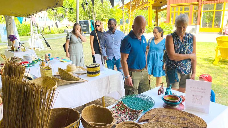Visitors take a close look at the handicrafts