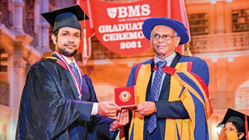 Glen Jude Bowen receives the Gold Medal from BMS President Dr. Wijewardena