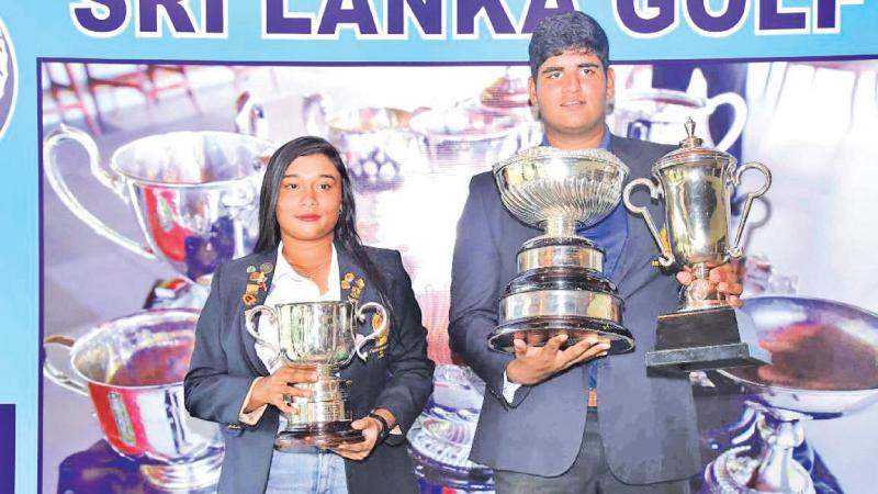 Taniya Balasuriya (left) and Nirekh Tejwani with their trophies