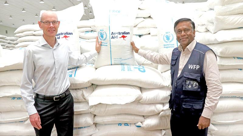 Australia’s High Commissioner to Sri Lanka Paul Stephens and Representative and Country Director of the World Food Programme Sri Lanka Abdur Rahim Siddiqui, at the warehouse in Veyangoda where the rice is being stored until distribution.