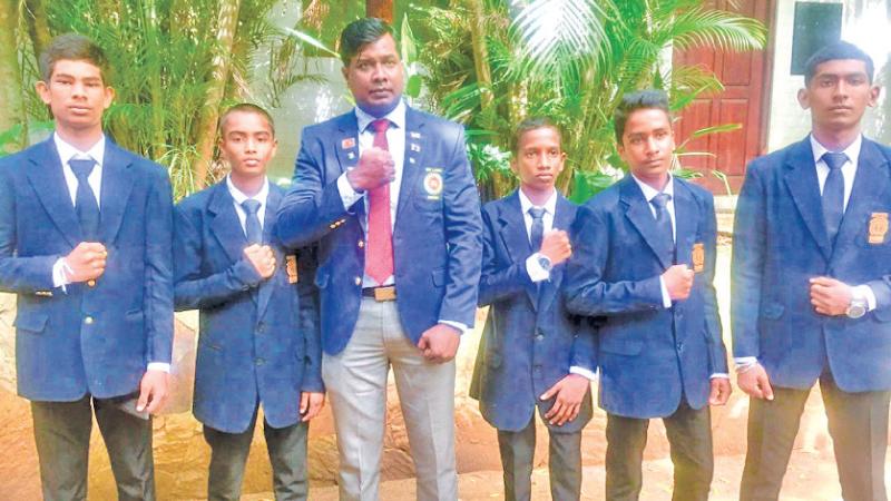 Southern Province boxers from Narandeniya Central College (from left) Adisha Nuwan Samarasekera, KPP Kavishwara, Pradeep Jayasinghe (coach), TT Palihawadana, M Ganidu Hasanka, LHP Nikshan