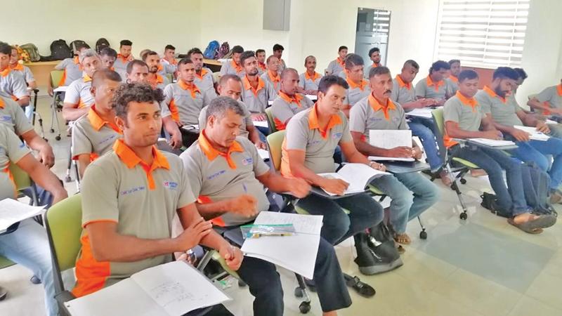 A batch of painters undergoing training