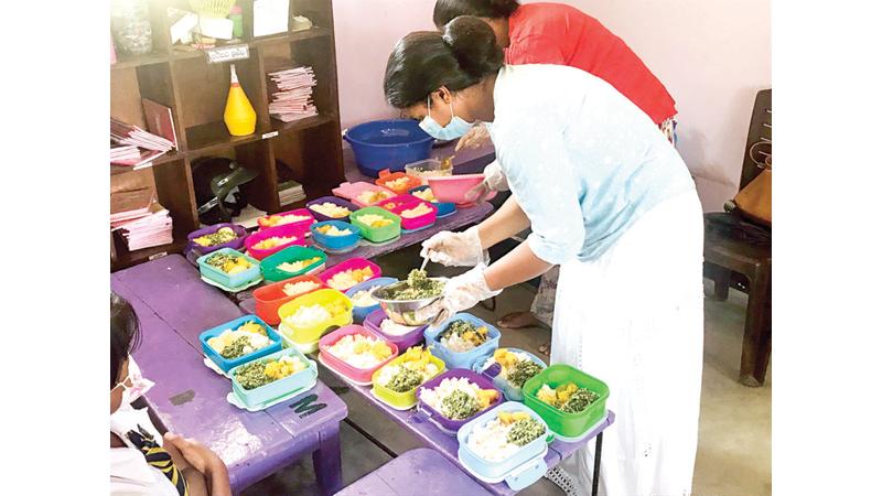 Meals being packed in lunch boxes