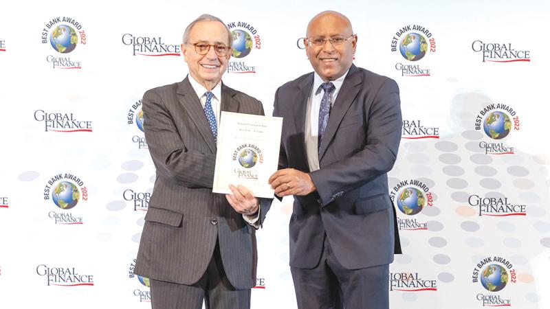 Director and Chief Executive Officer of NDB Bank, Dimantha Seneviratne receives the Global Finance Best Bank Sri Lanka 2022 award from Founder and Editorial Director of Global Finance Joseph Giarraputo.