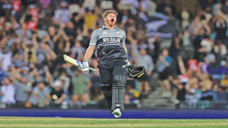 Glenn Phillips reacts after his hundred