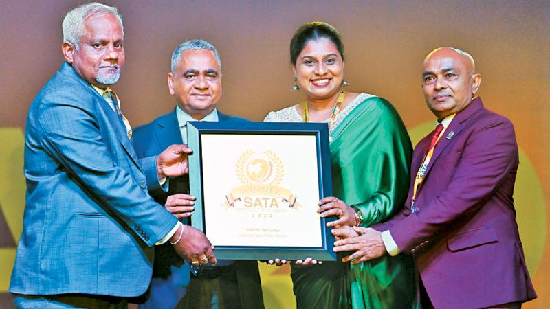 BMICH management team receiving the award from the SATA representative.