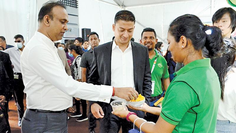 The two invitees, Minister of Plantations Dr. Ramesh Pathiranna and State Minister for Investment Promotion Dilum Amunugama at the exhibition.  Pic: Shirajiv Sirimane