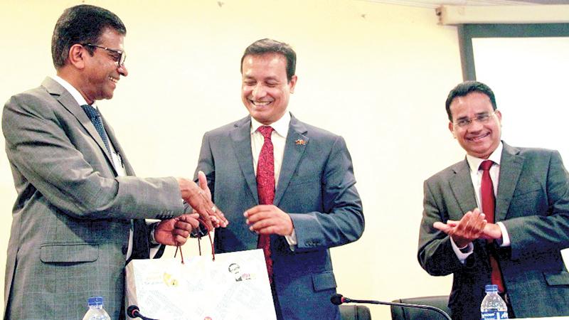 President, NCCSL, Nandika Buddhipala presents a token of appreciation to High Commissioner Tareq Md Ariful Islam Pic: Thushara Fernando