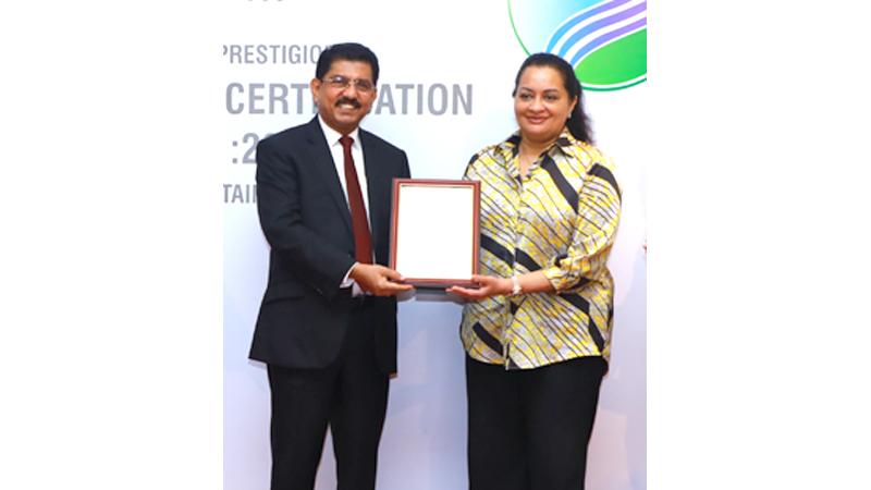 Managing Director,  Maliban Group, Ms. Kumudika Fernando receives the certification.