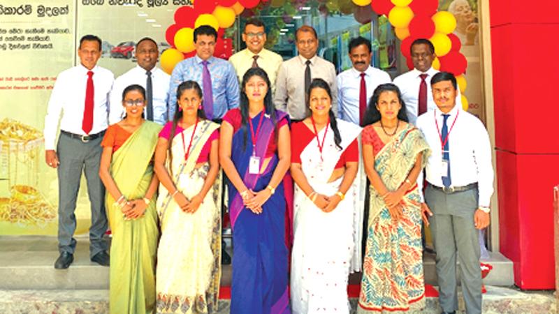 The senior management of Mahindra Ideal Finance with branch staff and customers on the opening day.
