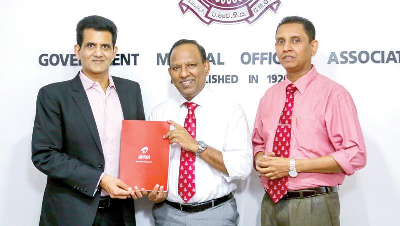 Airtel Lanka, CEO/MD, Ashish Chandra with GMOA President, Dr. Dharshana Sirisena, and GMOA Secretary, Dr. Haritha Aluthge