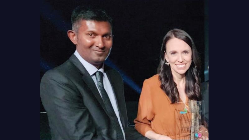 Prasan Gamage receives the award from Prime Minister of New Zealand, Jacinda Ardern