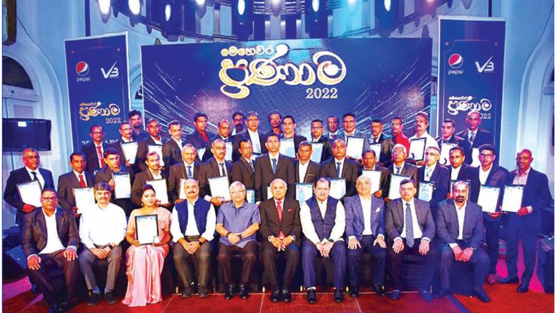 Varun Beverages officials with the employees who were felicitated