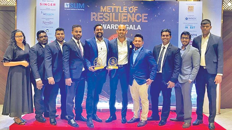 The Alerics team with the awards