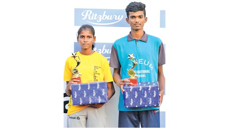 Thushara Mendis (right) and VPN Samadhi with the best athlete awards