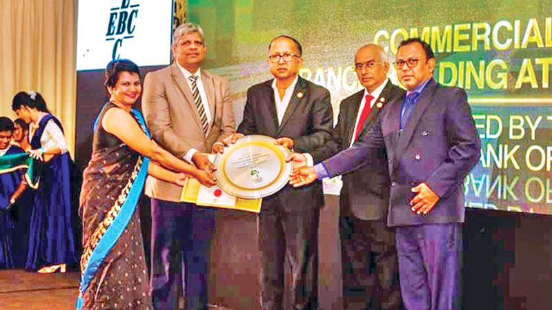 Commercial Bank’s Head of Premises Tilak Wakista (second from left) receives the award from Director GBCSL  Mahendra S. Jayalath. Looking on (from left): Project Green Accredited Professional Ms. Samantha Manawadu, GBCSL Director  Chandana Dalugoda and the Bank›s Executive Officer, Energy and Environment, Ravindra Kamburawala  