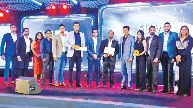 The HNB digital marketing team and agency (Group M) with HNB Head of Marketing Upul Adikari (fifth from right) at the awards ceremony